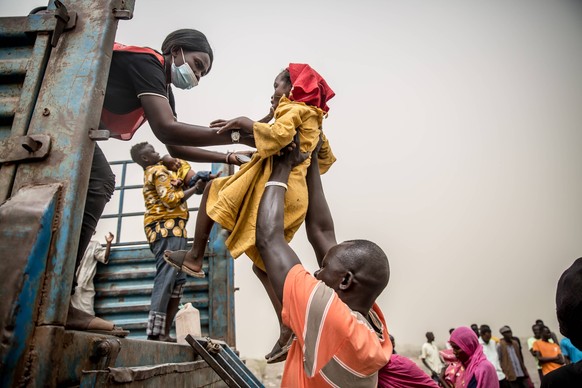 March 20, 2024, Joda, South Sudan: A child is loaded into a truck taking people fleeing Sudan s war from Joda, on the Sudanese border, to Renk in South Sudan, where they will stay in a transit camp be ...