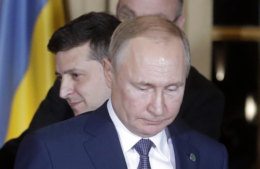 Wladimir Putin (v.) und Wolodomyr Selenskyj (h.) haben eine Waffenruhe vereinbart.