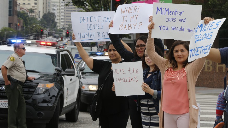 Immigrant rights protesters hold a rally outside the Los Angeles Federal building Saturday, Jun. 23, 2018. In recent weeks, more than 2,300 children were taken from their families under a &quot;zero-t ...