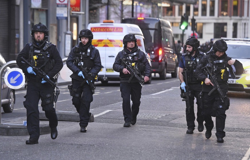 Police on Cannon Street in London near the scene of an incident on London Bridge in central London following a police incident, Friday, Nov. 29, 2019. British police cleared the area around London Bri ...