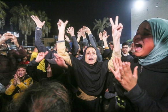 People celebrate In Deir al-Balah, central Gaza Strip, on Wednesday on January 15, 2025, amid the ongoing war in the Palestinian territory between Israel and Hamas. Thousands of Gazans celebrated on J ...