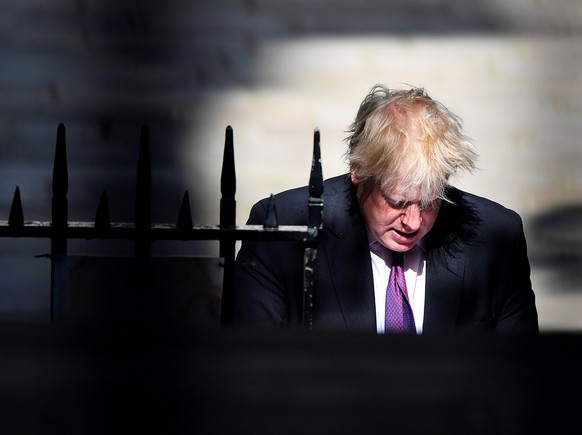 FILE PHOTO: Britain's Foreign Secretary Boris Johnson walks to Downing Street in London, June 26, 2018. REUTERS/Toby Melville/File Photo