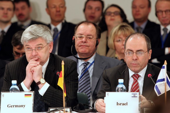 JERUSALEM - MARCH 16: German Foreign Minister Joschka Fischer (L) listens to Israeli Foreign Minister Silvan Shalom address a special assembly of world leaders for the inauguration of the new museum a ...