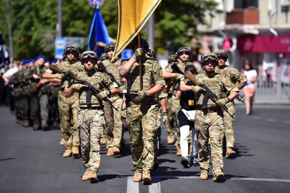 Soldiers of the Azov Regiment march down a street as the city marks five years since the liberation from the pro-Russia separatists of the so-called Donetsk People s Republic , Mariupol, Donetsk Regio ...
