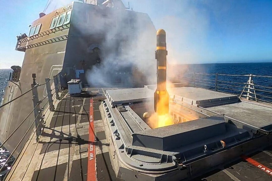 An AGM-114L Longbow Hellfire missile launches from the Surface-To-Surface Missile Module SSMM aboard Independence-variant Littoral Combat Ship USS Montgomery LCS 8. The missile exercise was the first  ...