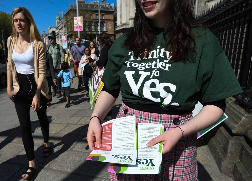 May 16, 2018 - Dublin, Ireland - Activists from the Trinity Together for Yes campaign canvass in front of the main entrance to Trinity College, urging a yes vote in the referendum to repeal the eighth ...