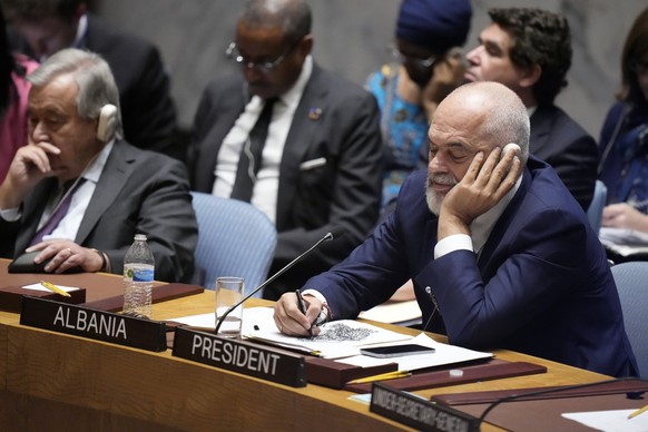 Security Council President and Prime Minister of Albania Edi Rama listens as Russian Foreign Minister Sergey Lavrov speaks during a high level Security Council meeting on the situation in Ukraine, Wed ...