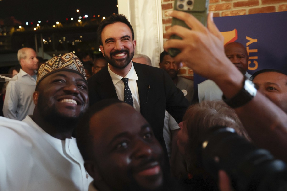 Democratic mayoral candidate Zohran Mamdani takes selfies with supporters after speaking at his primary election party, Wednesday, June 25, 2025, in New York. (AP Photo/Heather Khalifa)