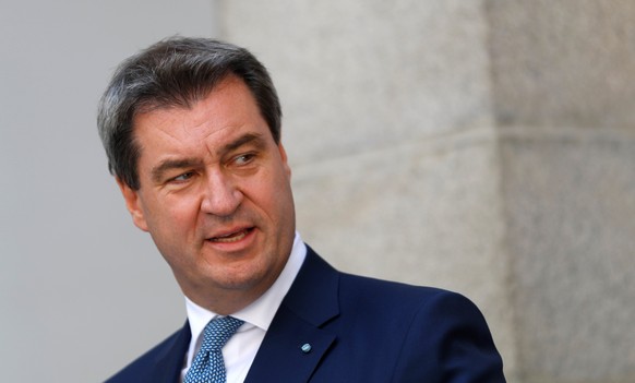 FILE PHOTO: Bavaria's Prime Minister Markus Soeder addresses a news conference after a joint Austrian and Bavarian cabinet meeting in Linz, Austria, June 20, 2018. REUTERS/Leonhard Foeger/File Photo