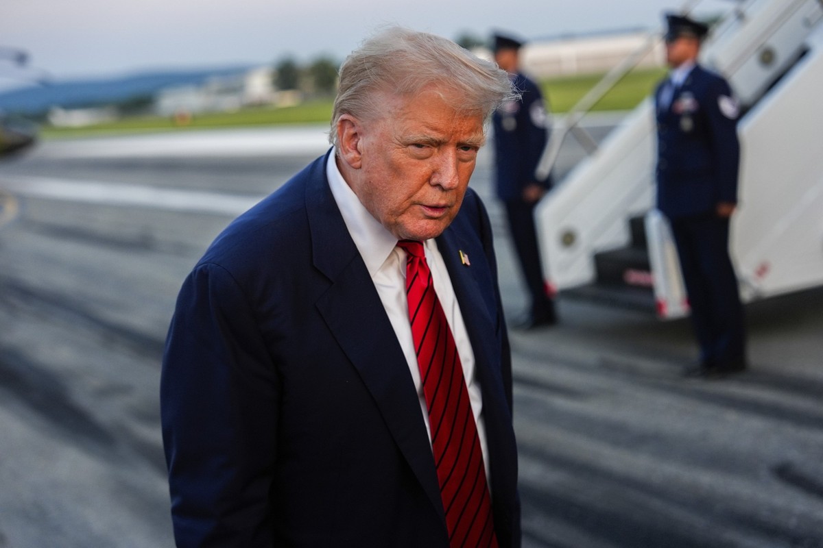 President Donald Trump speaks with reporters before boarding Air Force One at Lehigh Valley International Airport, Sunday, Aug. 3, 2025, in Allentown, Pa. (AP Photo/Julia Demaree Nikhinson)