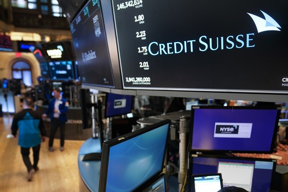 A sign displays the name of Credit Suisse on the floor at the New York Stock Exchange in New York, Wednesday, March 15, 2023. (AP Photo/Seth Wenig)