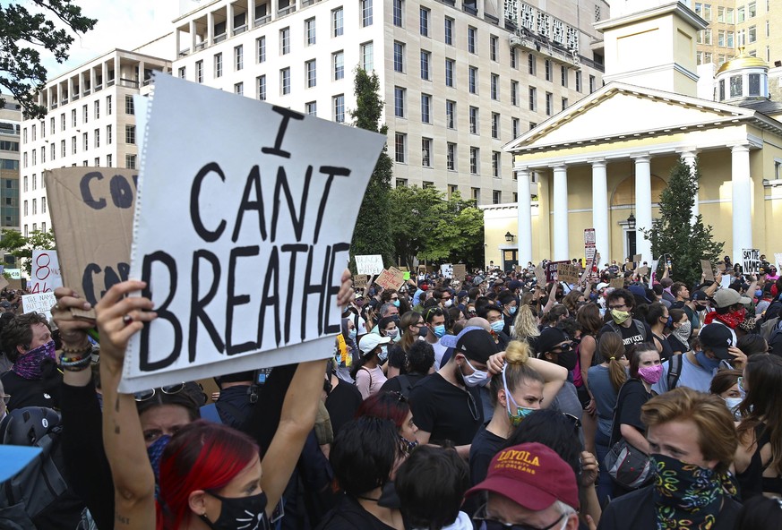 Marchers protesting the Minnesota police killing of George Floyd hold a demonstration in front of St. John s Church on Tuesday, June 2, 2020 in Washington D.C. Activists nationwide defied curfews in s ...