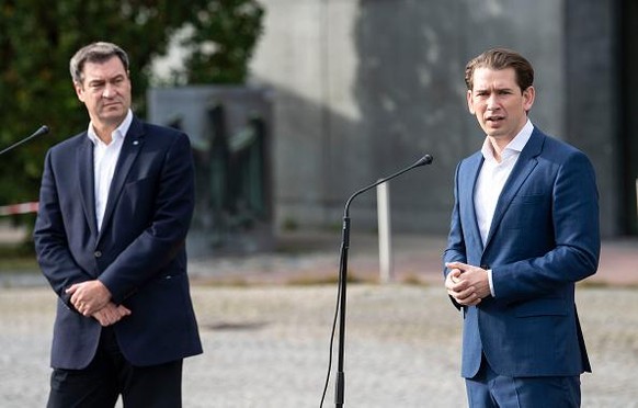 BAD REICHENHALL, GERMANY - OCTOBER 09: Bavarian Prime Minister Markus Soeder (L) and Austria's Federal Chancellor Sebastian Kurz speak to the media after a meeting at the German-Austrian Border on Oct ...