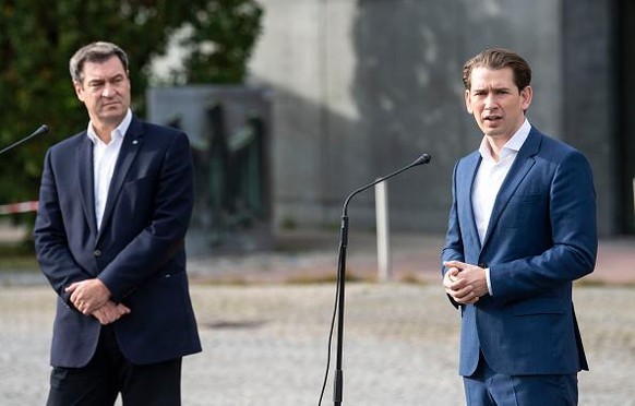 BAD REICHENHALL, GERMANY - OCTOBER 09: Bavarian Prime Minister Markus Soeder (L) and Austria&#039;s Federal Chancellor Sebastian Kurz speak to the media after a meeting at the German-Austrian Border o ...