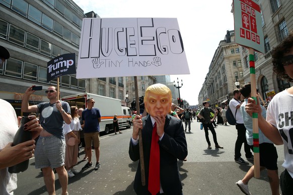 Protesters hold signs at the 'Stop Trump' Women's March in London, Friday, July 13, 2018. “Super Callous Fragile Racist Sexist Nazi POTUS”: That placard, referencing Mary Poppins, is just one of the m ...