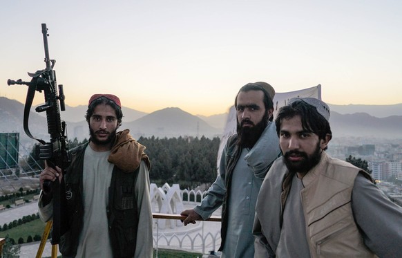 KABUL, AFGHANISTAN - OCTOBER 12, 2021: Taliban fighters stand on the hill of Wazir Akbar Khan. On August 15, the Taliban forces entered Kabul without any resistance from the government, President Ashr ...