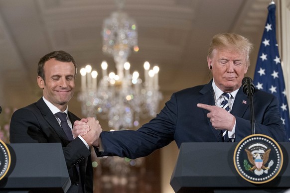President Donald Trump and French President Emmanuel Macron shake hands during a news conference in the East Room of the White House in Washington, Tuesday, April 24, 2018. (AP Photo/Andrew Harnik)