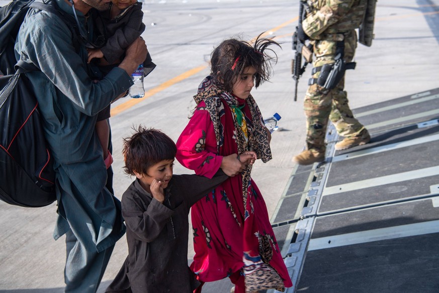 STYLELOCATIONAfghan refugees board a C-17 Globemaster III aircraft for evacuation from Hamid Karzai International Airport during Operation Allies Refuge August 24, 2021 in Kabul, Afghanistan. Kabul Af ...