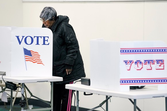 A voter casts an early ballot at a polling station Thursday, Feb. 9, 2023, in Milwaukee. Recent revelations about Republican election strategies targeting minority communities in Wisconsin’s biggest c ...