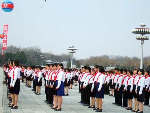 &quot;PYONGYANG, Korea, North - MARCH 23, 2010: North Korean pioneer kids in preparation for military parade&quot;