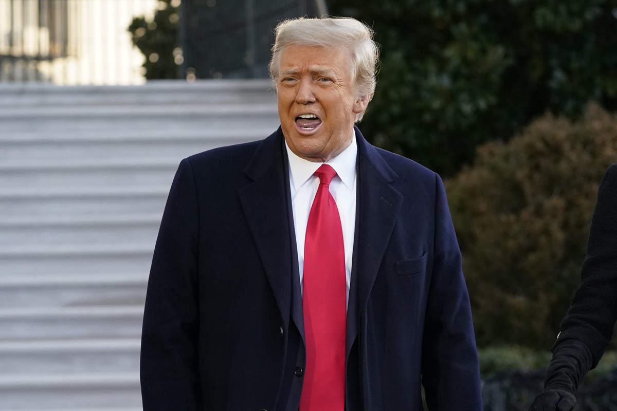 President Donald Trump speaks with reporters as he walks to board Marine One on the South Lawn of the White House, Wednesday, Jan. 20, 2021, in Washington. Trump is en route to his Mar-a-Lago Florida ...