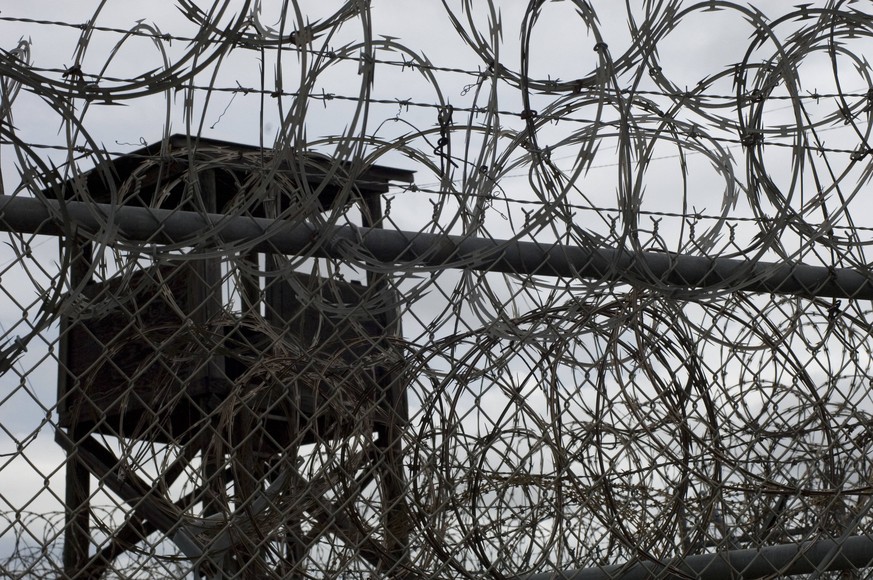 Oct 02, 2007 - Guantanamo Bay, Cuba - A fence, guard tower and razor wire in Camp X-ray, which is now closed and was the initial facility used to hold detainees in Guantanmo Bay. The U.S. Government i ...