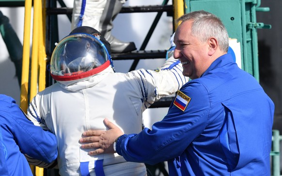 KAZAKHSTAN - OCTOBER 11, 2018: Head of Roscosmos (Russian Federal Space Agency) Dmitry Rogozin (R) attends a send-off ceremony for Roscosmos cosmonaut Alexei Ovchinin and NASA astronaut Nick Hague of  ...
