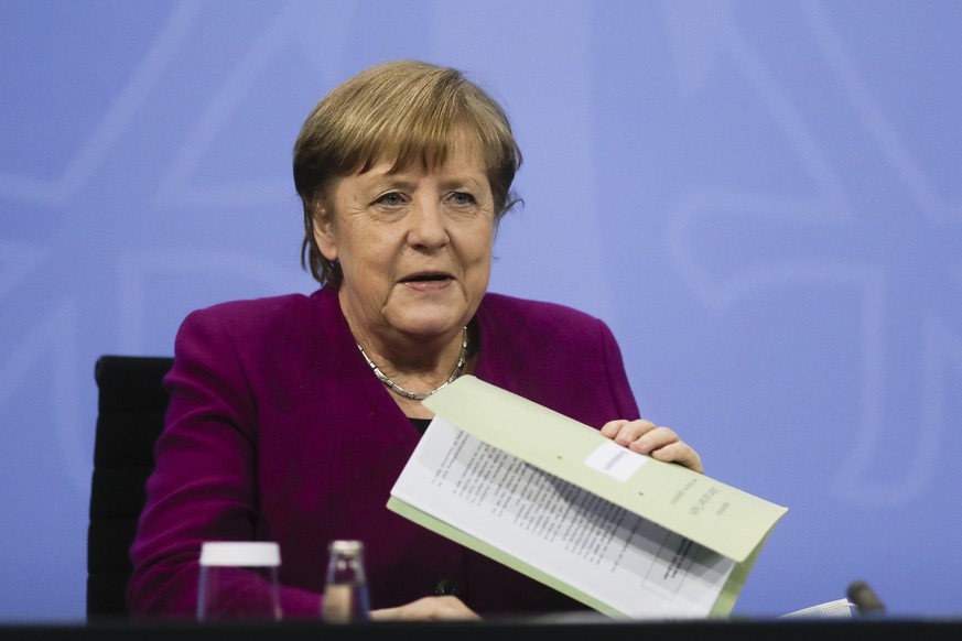 CORRECTS DAY - German Chancellor Angela Merkel attends a news conference with Bavarian state governor Markus Soeder and the Mayor of Berlin Michael Mueller after a meeting at the chancellery in Berlin ...