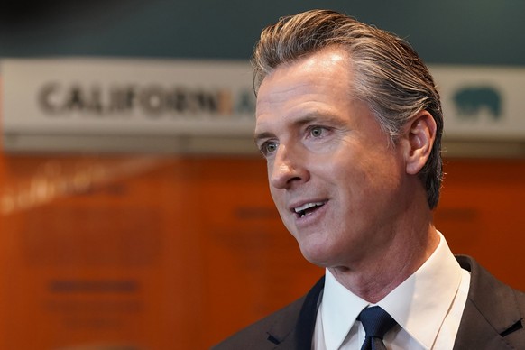 FILE - California Gov. Gavin Newsom talks to reporters after voting in Sacramento, Calif., Tuesday, Nov. 8, 2022. Newsom has agreed to release $1 billion in state homelessness funding he testily put o ...