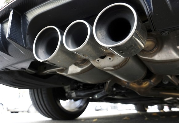 Exhaust pipes of a car are pictured in Berlin, Germany, Tuesday, Oct. 9, 2018. Due to environment protection reasons the city of Berlin has to introduce a diesel driving ban on several highly frequent ...