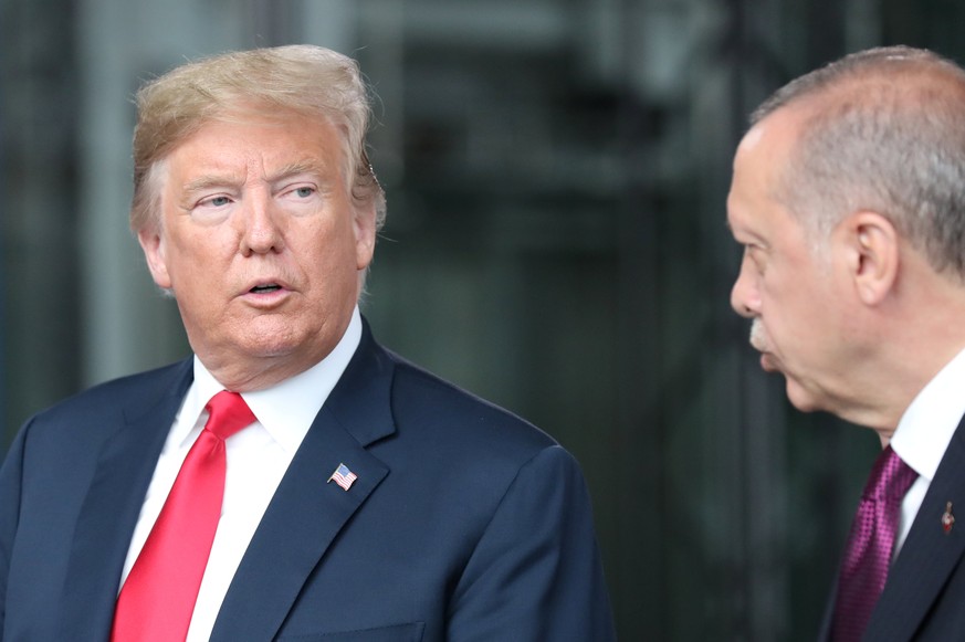 U.S. President Donald Trump talks to Turkey’s President Recep Tayyip Erdogan at NATO headquarters in Brussels, Belgium July 11, 2018. Tatyana Zenkovich/Pool via REUTERS