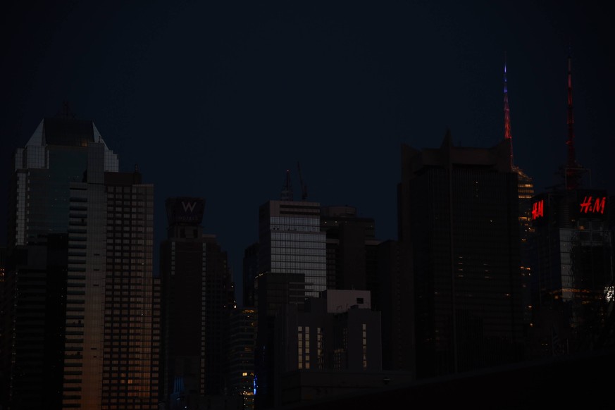 July 13, 2019, New York, NY, USA: The darkened skyline of Manhattan as a power outage has struck New York City. New York USA *** July 13, 2019, New York, NY, USA The darkened skyline of Manhattan as a ...