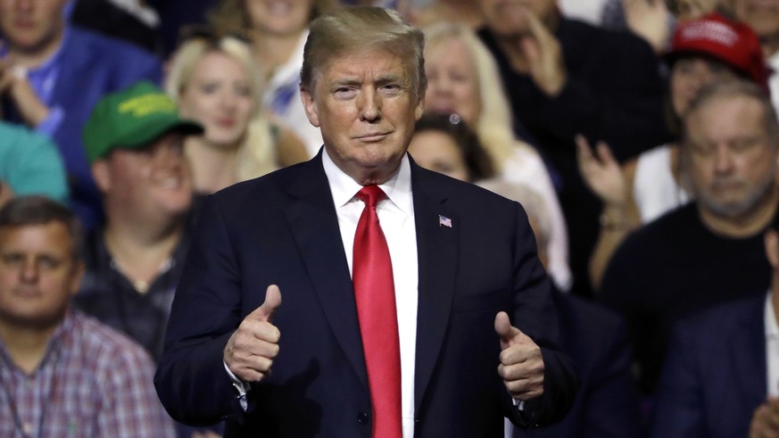 President Donald Trump gestures during a rally Tuesday, July 31, 2018, in Tampa, Fla. (AP Photo/Chris O&#039;Meara)