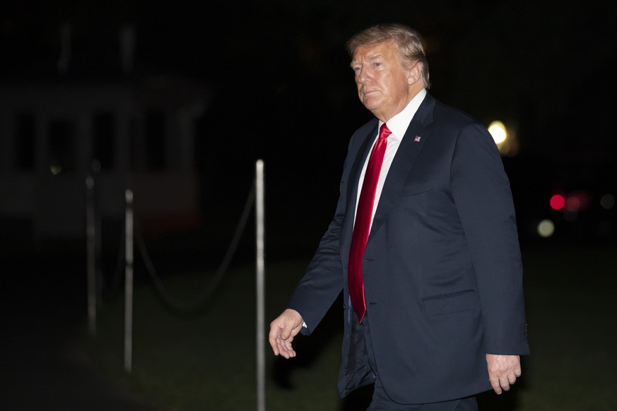 President Donald Trump walks on the South Lawn of the White House after returning on Marine One, early Wednesday, June 24, 2020, in Washington. Trump returned from Arizona. (AP Photo/Alex Brandon)