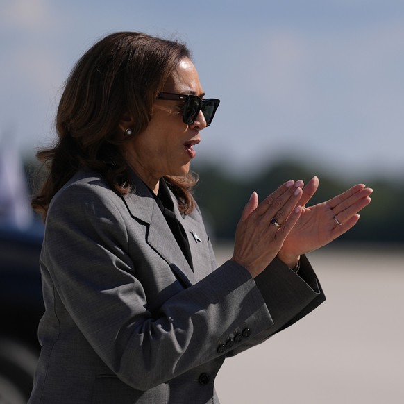 Vice President Kamala Harris walks across the tarmac before boarding Air Force Two at Dobbins Air Reserve Base in Marietta, Ga. (AP Photo/Brynn Anderson)