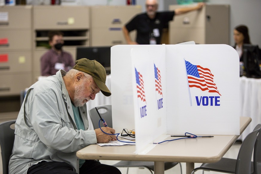 Voters cast their ballots on Friday, Sept. 23, 2022, in Minneapolis. With Election Day still more than six weeks off, the first votes of the midterm election were already being cast Friday in a smatte ...