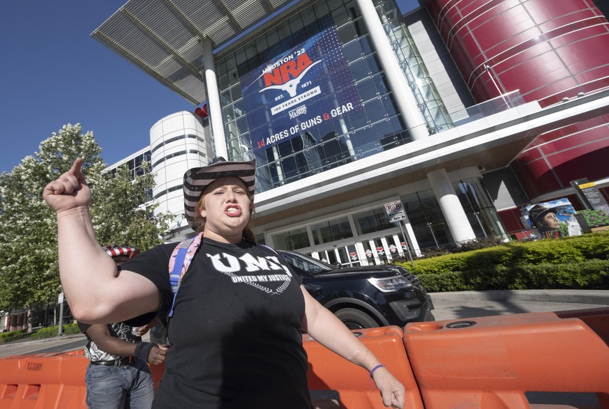 May 26, 2022, Houston, Texas, USA: LIZ BADGLEY of Fort Worth, Texas is one of a handful of protesters outside the George R. Brown Convention Center in Houston on the eve of the National Rifle Assn. (N ...