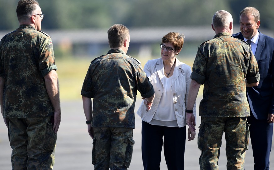 German Defence Minister Annegret Kramp-Karrenbauer welcomes soldiers as she visits troops of the German army Bundeswehr in Celle, Germany July 24, 2019. REUTERS/Fabian Bimmer