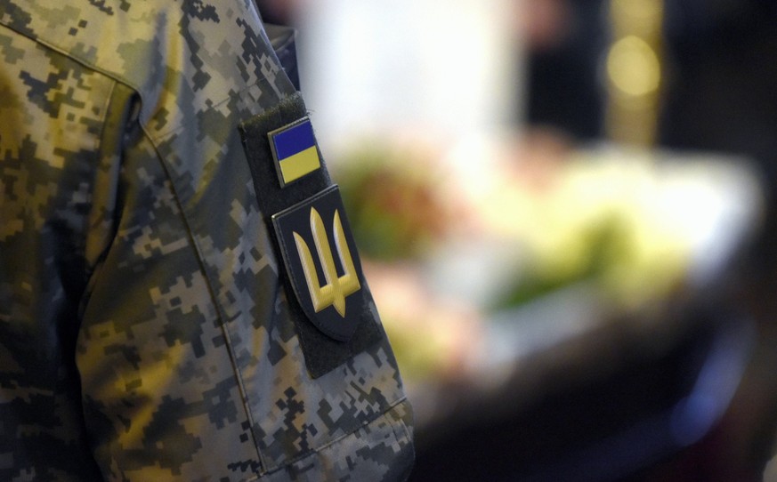 KYIV, UKRAINE - FEBRUARY 14, 2024 - A shoulder sleeve insignia of a Ukrainian soldier is pictured during the memorial service of combat medic of the 49th Carpathian Sich Infantry Battalion Diana Wagne ...