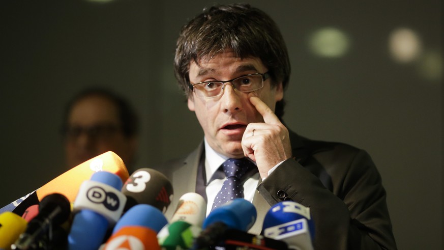 Former Catalan leader, Carles Puigdemont, addresses the media during a news conference in Berlin, Germany, Tuesday, May 15, 2018. (AP Photo/Markus Schreiber)