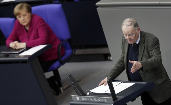 Alexander Gauland, right, co-faction leader of the Alternative for Germany party, AfD, delivers a speech during a meeting of the German federal parliament, Bundestag, at the Reichstag building in Berl ...