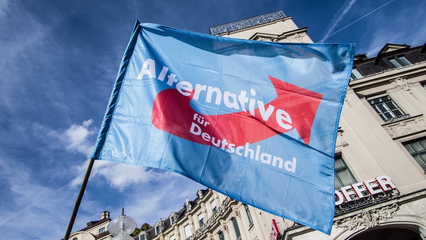 September 22, 2018 - Munich, Bavaria, Germany - An AfD flag being waved at Munich s Karlsplatz Stachus. This Oktoberfest Saturday the far-right to extreme-right Alternative For Germany (AfD) party org ...