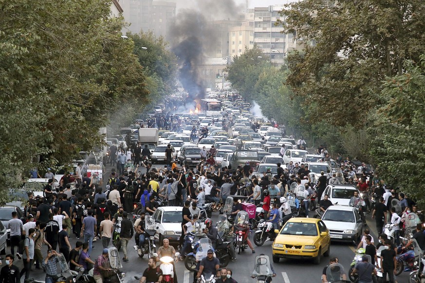 FILE - In this photo taken by an individual not employed by the Associated Press and obtained by the AP outside Iran, protesters chant slogans during a protest over the death of a woman who was detain ...