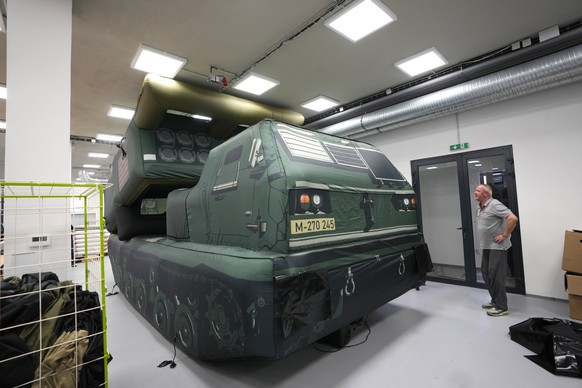 An inflatable decoy of High Mobility Artillery Rocket System (HIMARS) is presented to media in Decin, Czech Republic, Monday, March 6, 2023. Czech company, Inflatech, has made a wide range of replicas ...