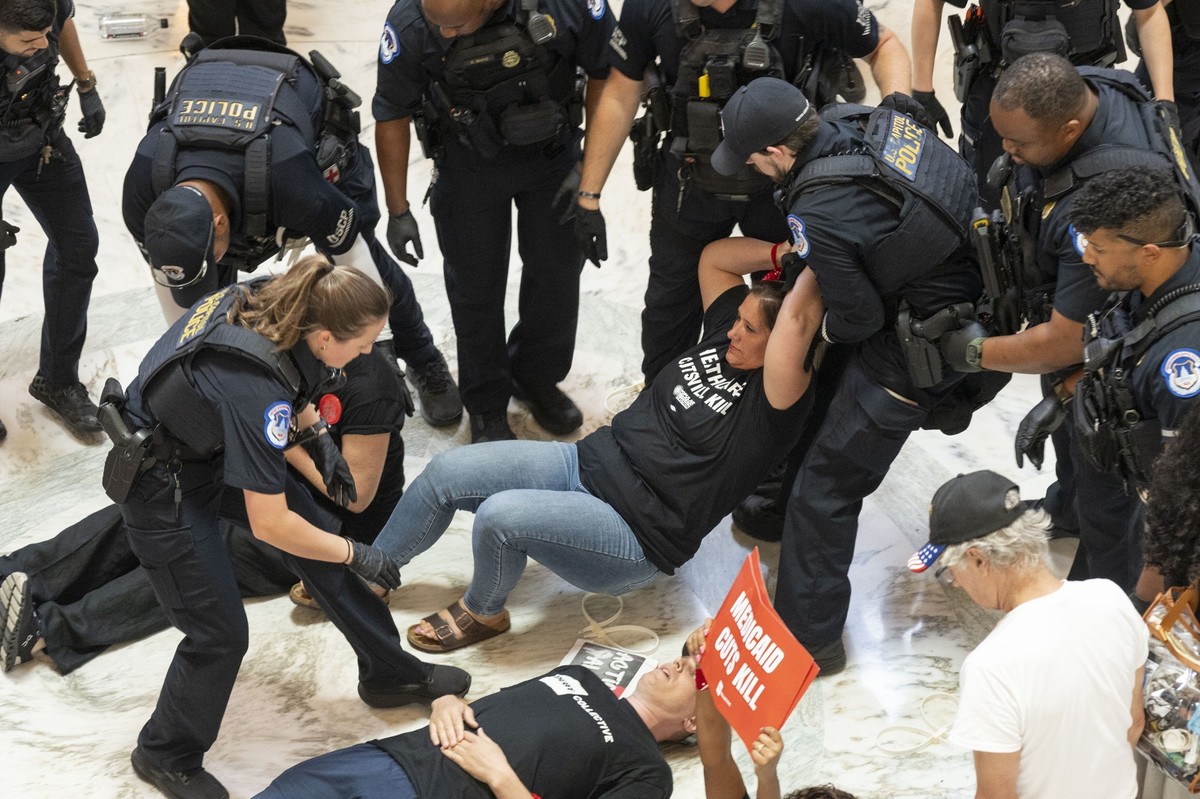 IMAGE DISTRIBUTED FOR THE DEBT COLLECTIVE - Medicaid and SNAP recipients are arrested during a protest of proposed cuts to social safety net programs in the Rotunda of the Russell Senate Office Buildi ...