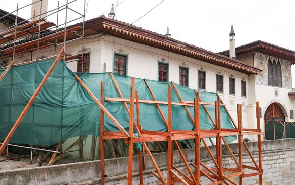 CRIMEA, RUSSIA FEBRUARY 9, 2022: Renovation work at the Khan Palace in the town of Bakhchisarai, Crimea. A 3 metre crack has appeared on the wall of the Khan Palace s Courtiers House, around which dig ...