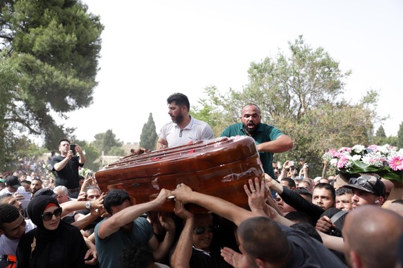 May 13, 2022, Jerusalem, Jerusalem, Palestinian Territory: Mourners carry slain Al Jazeera veteran journalist Shireen Abu Akleh during her funeral procession in the Old City of Jerusalem on May 13, 20 ...