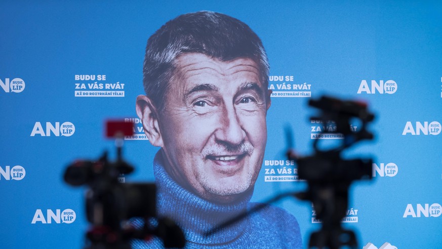October 9, 2021, Prague, Czech Republic: Video cameras seen in front of a banner displaying Czech Prime Minister Andrej Babis from ANO party at the party s headquarters during the parliamentary electi ...
