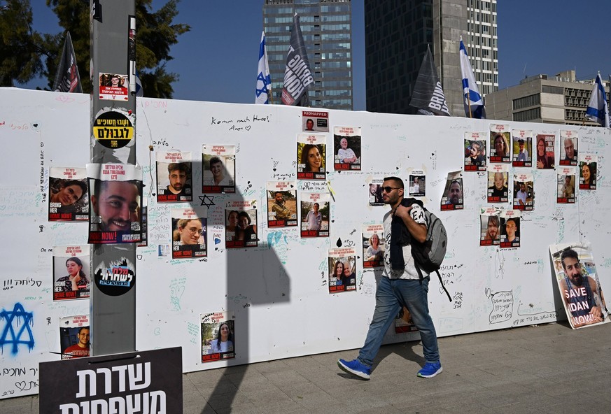 People visit Hostage Square outside the Tel Aviv Museum of Art in Tel Aviv on Thursday, November 23, 2023. Qatar announced that the Israel-Hamas hostage deal will begin at 7 a.m. Friday when the war w ...