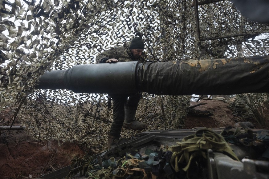 A soldier of the 12th Special Forces Brigade Azov of the National Guard prepares to fire a 155mm self-propelled gun M109 Paladin, towards Russian positions at the front line, near Kreminna, Luhansk re ...